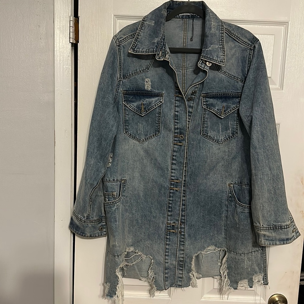 Gorgeous distressed jean jacket.  Size Medium. New